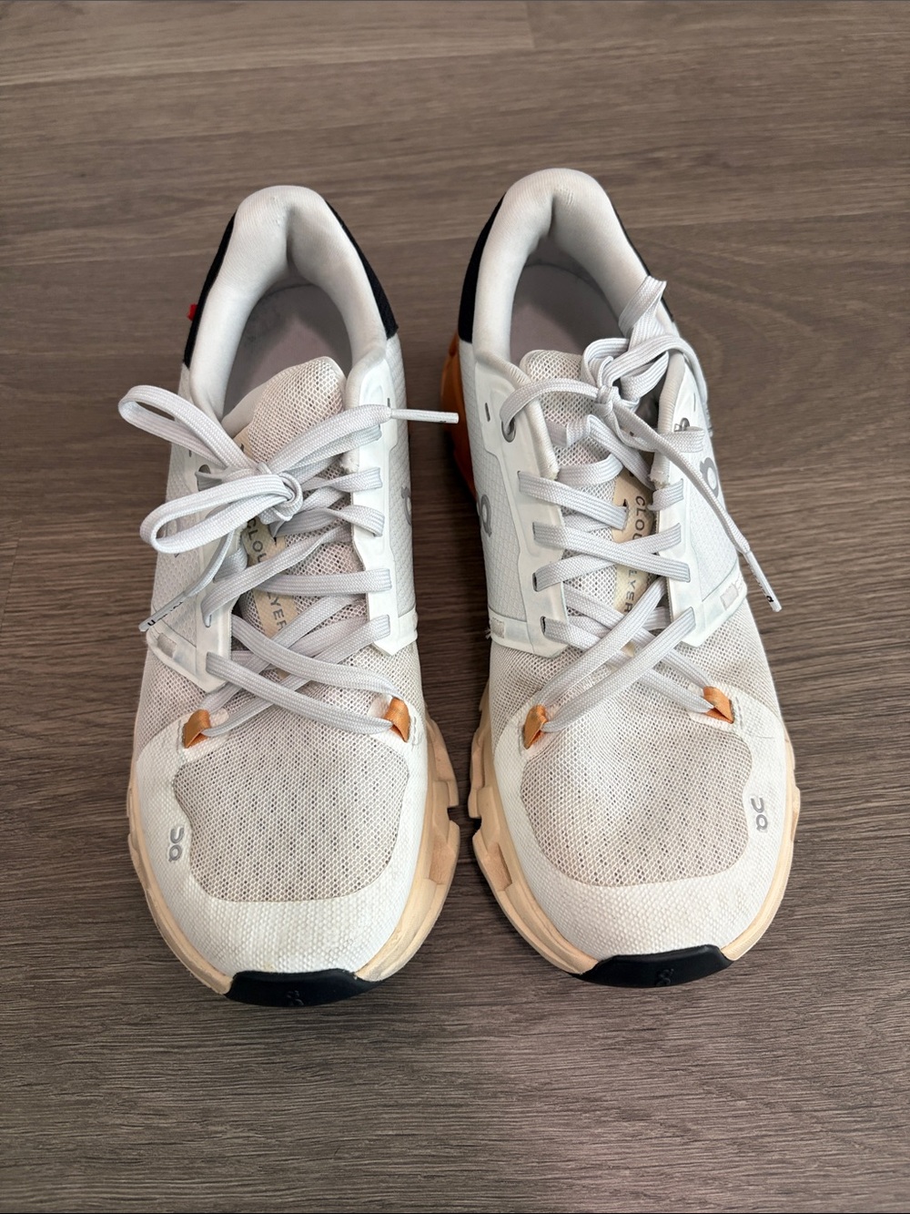 On Running cloudflyer White Sneakers with orange Accents and Black Heel